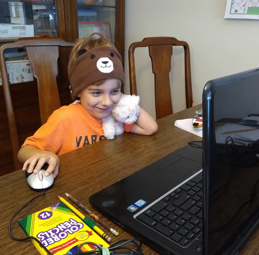 Photo of boy using computer