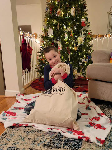 Child holding Holiday Giving