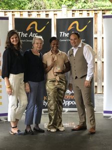 Javonna Thomas receives her award at Celebration Impact