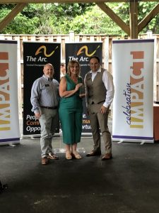 Karen Cratty receives her award at Celebration Impact